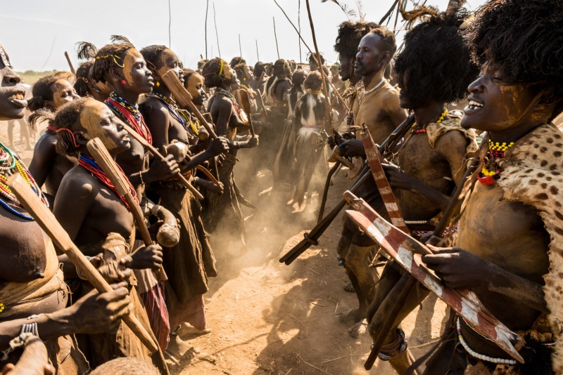 Men from the Dassanech tribe line up across from the women while they dance and sing during the Dimi ceremony.