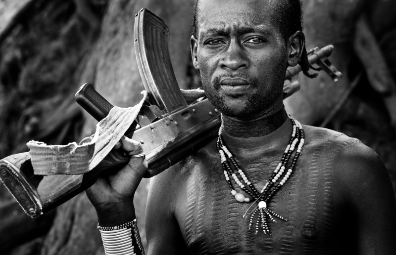 Portrait of a Hamer Man with AK-47.