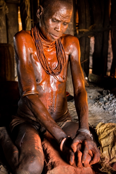 Hami Grinding Her Clay.