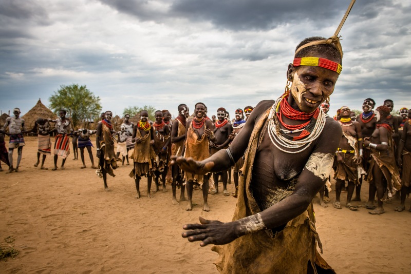 An older woman from the Kara tribe dances during a celebration in Dus Village.