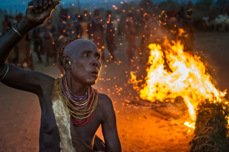 Bi Lale, a woman from the Kara tribe, dances in celebration at the end of the Bull Jump ceremony in Dus Village.  g